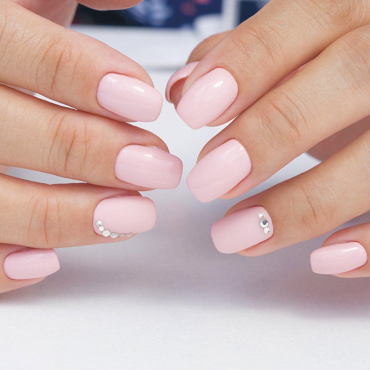 Pale pink nude gel nails with gemstones from Beautiful home salon