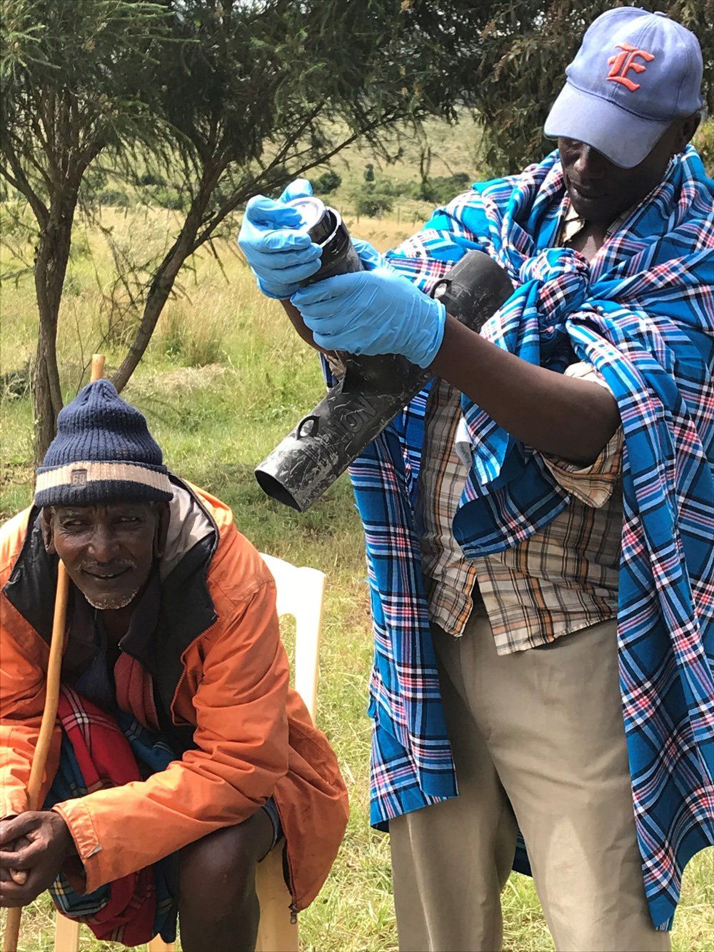 African People Setting Mouse Trap — Bradford, FL — Bowen & Bug Blocker Service