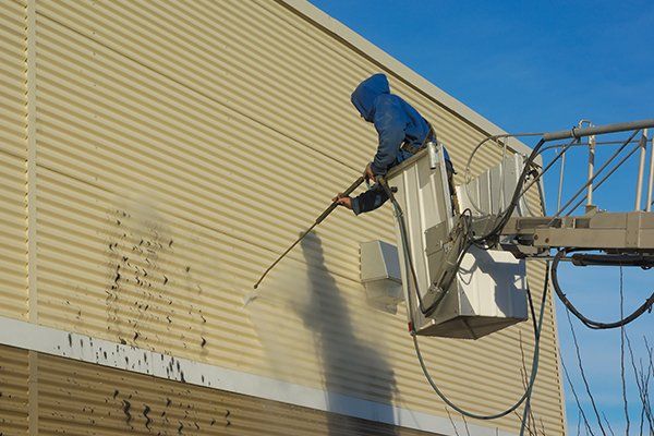 Cleaning a Wall with a Water Jet Pressure — Myerstown, PA — Your Choice Specialties