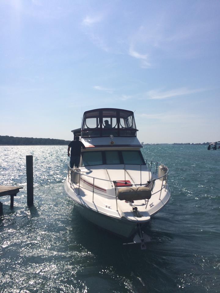 A boat is docked at a dock in the water