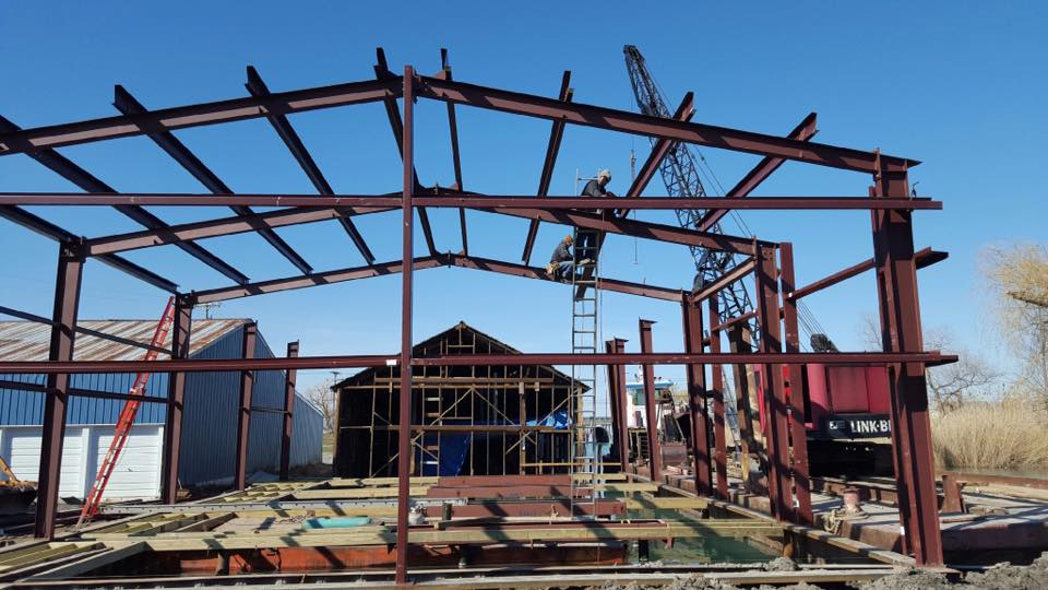 A building under construction with a crane in the background