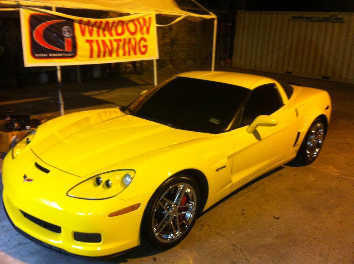 neon yellow sports car with tinted windows