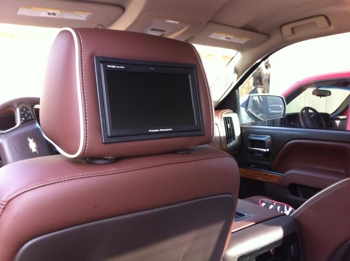 newly installed video screen in driver's headrest