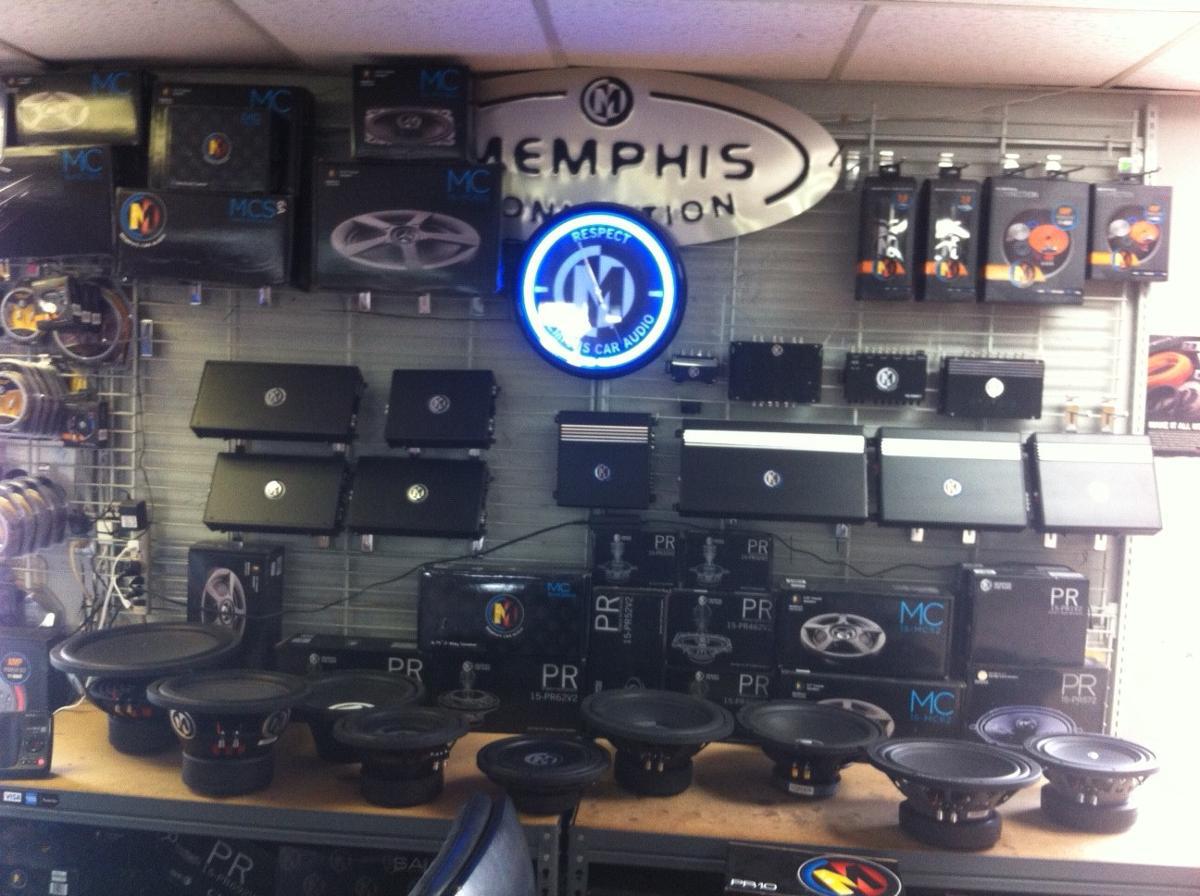 selection of speakers and audio systems on wall