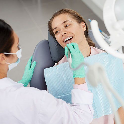 Dentist Cleaning Woman's Teeth — Leominster, MA — Lanza Dental Office Dentist Cleaning Woman's Teeth — Leominster, MA — Lanza Dental Office