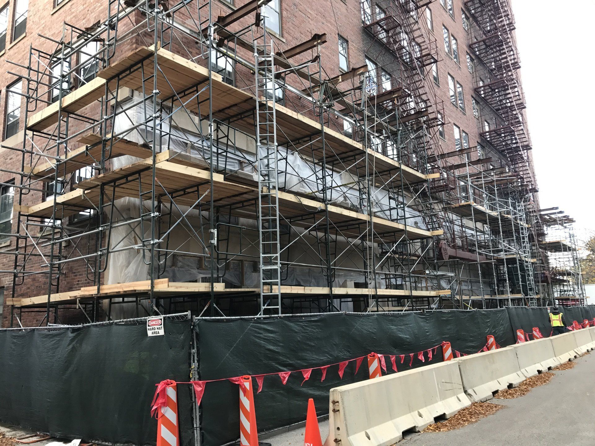 A building under construction with scaffolding on the side of it.