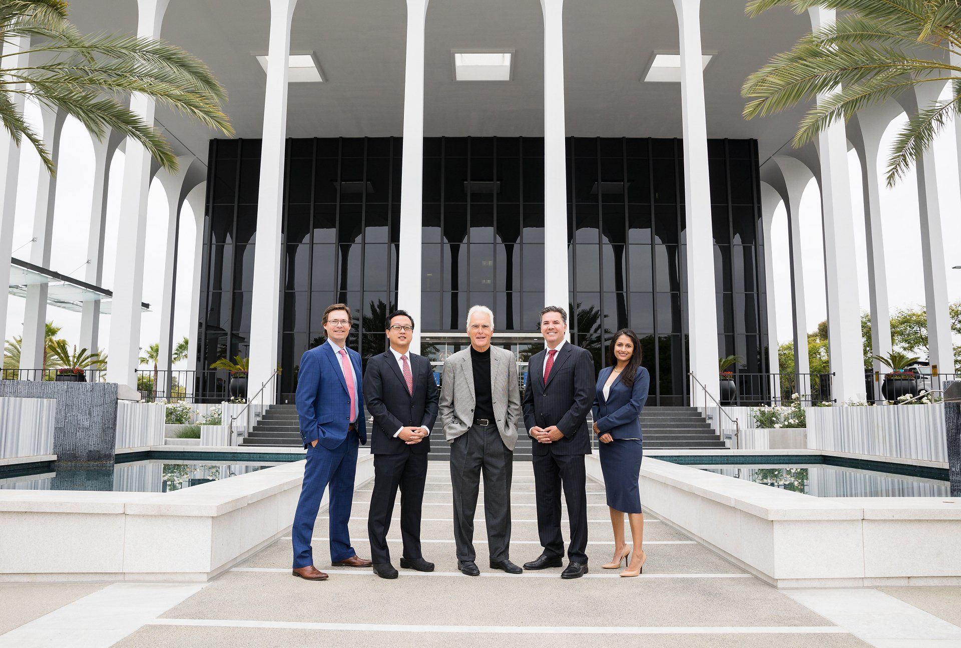 A group of people standing in front of a building.