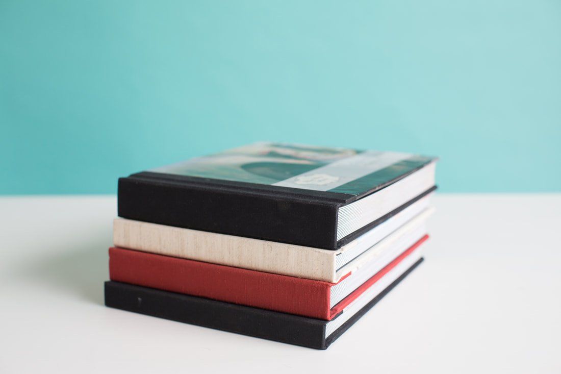 A stack of books sitting on top of each other on a table.