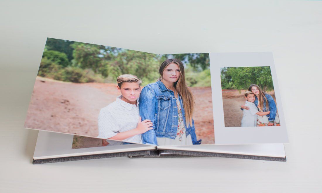 A book is open to a page with a picture of a woman and a boy.