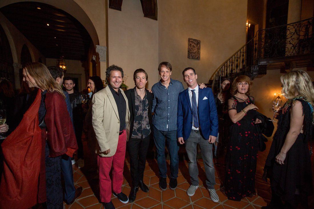 A group of people are posing for a picture in a room.