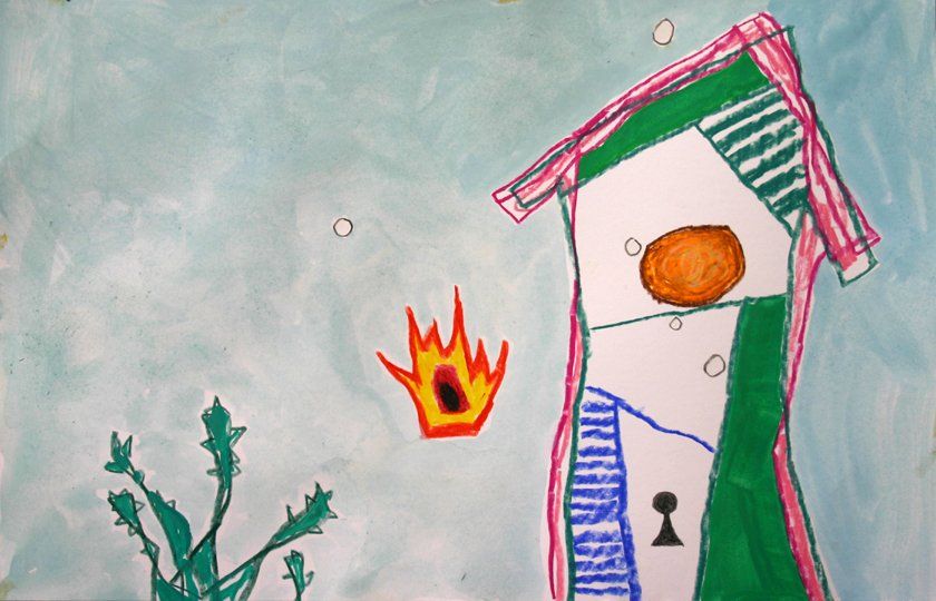 A child 's drawing of a house with a fire coming out of it