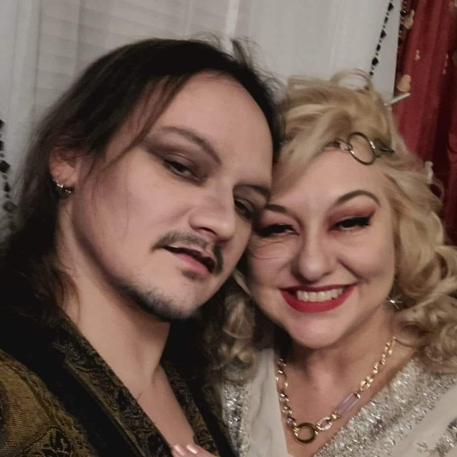 A man and a woman are posing for a picture together, Dusty Dionne and Belladonna LaVeau.
