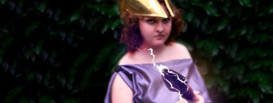 A woman wearing a helmet and holding a spear, representing Athena.