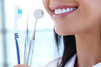 Dentist With Dental Tools — Dental Care in  Burgettstown, PA