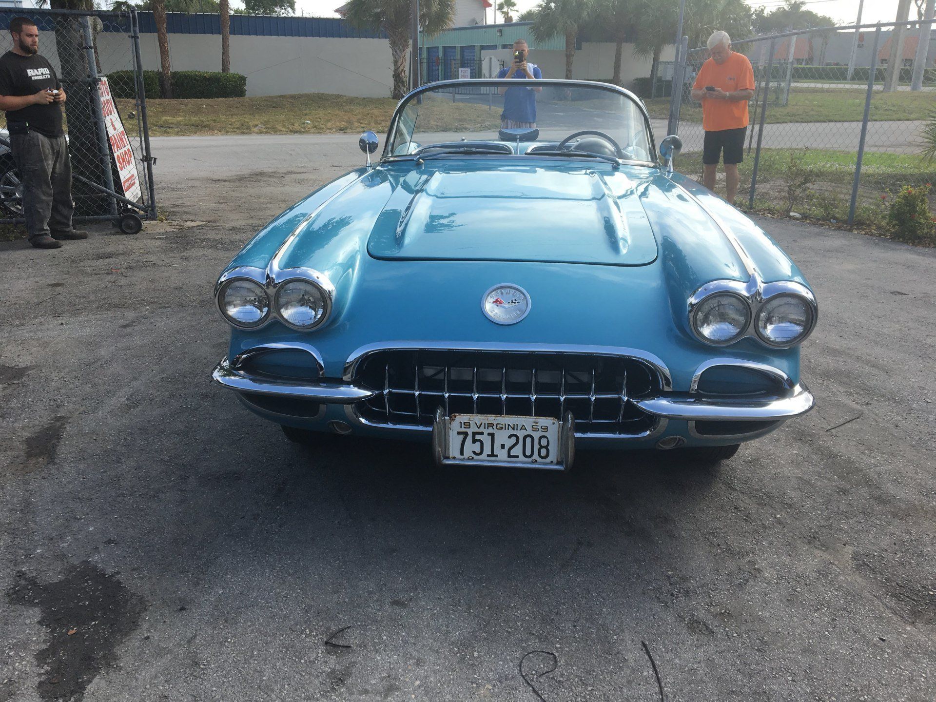 A blue car with a license plate that says 151-206
