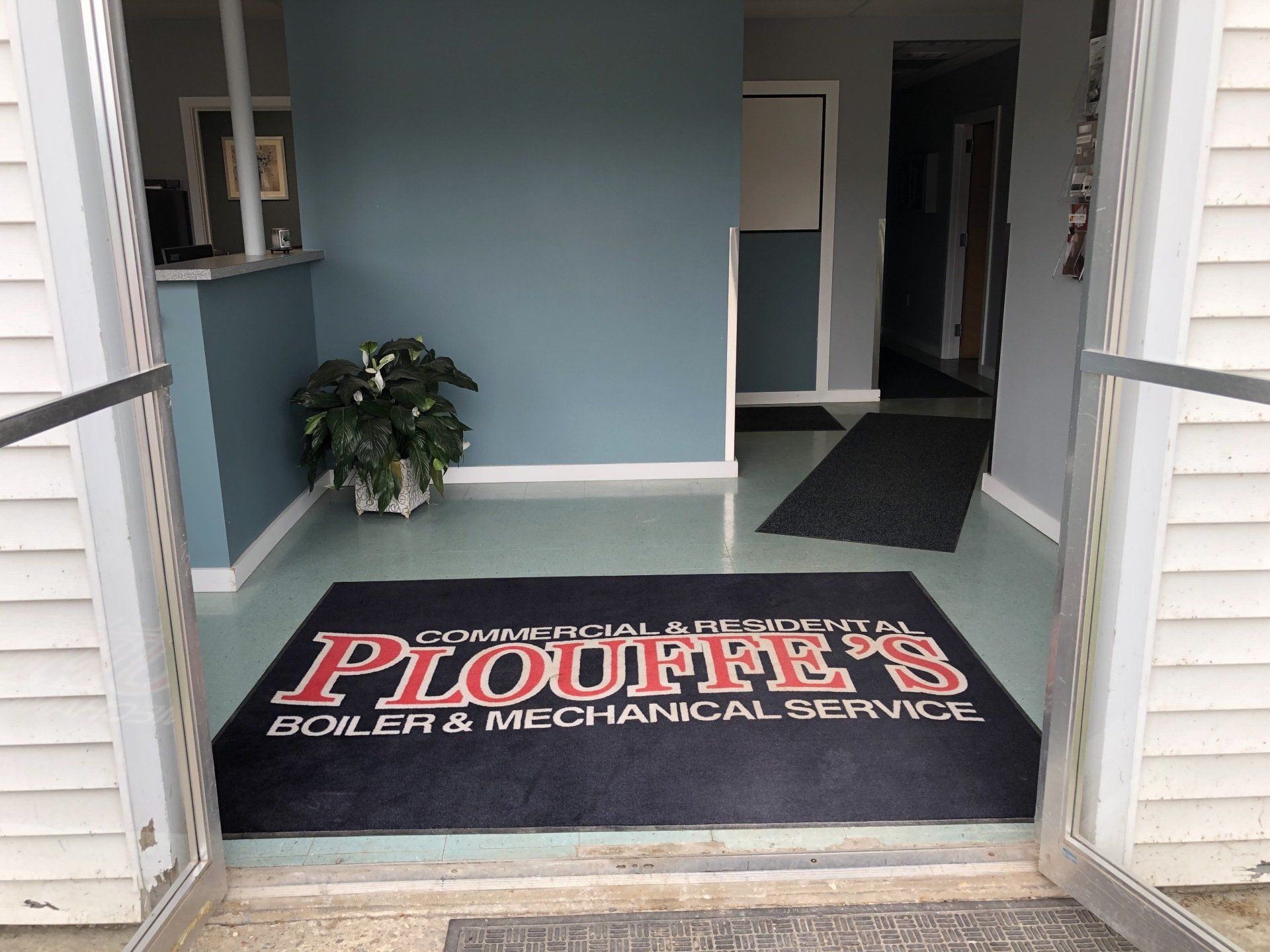 Technician Servicing Water Heater — Middlebury, VT — Plouffe's Boiler & Mechanical Service Inc