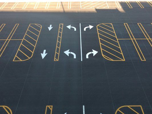 Parking Lot with Signs — Bloomington, IL — McLean County Asphalt Co.