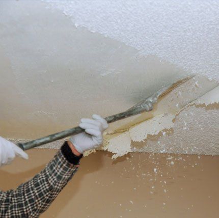 Worker Removing the Popcorn Ceiling — Clearwater, FL — Baird Quality Painting Worker Removing the Popcorn Ceiling — Clearwater, FL — Baird Quality Painting