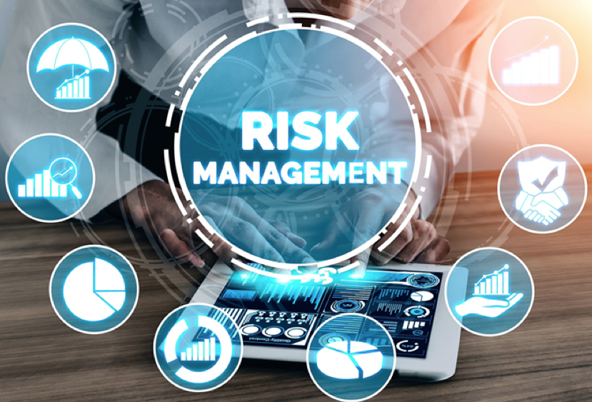 A man is using a tablet with a screen that says risk management