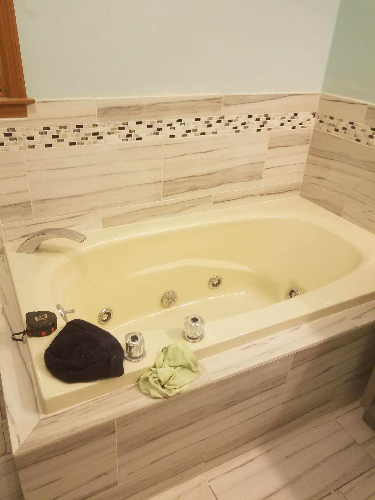 Bathtub and backsplash after bathroom remodel in Fairfield, CT