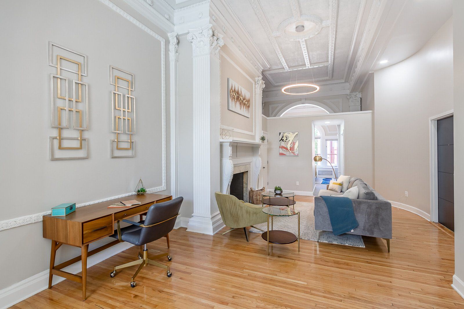 Ballroom apartment living room with high ceilings, hardwood floors, and vintage details