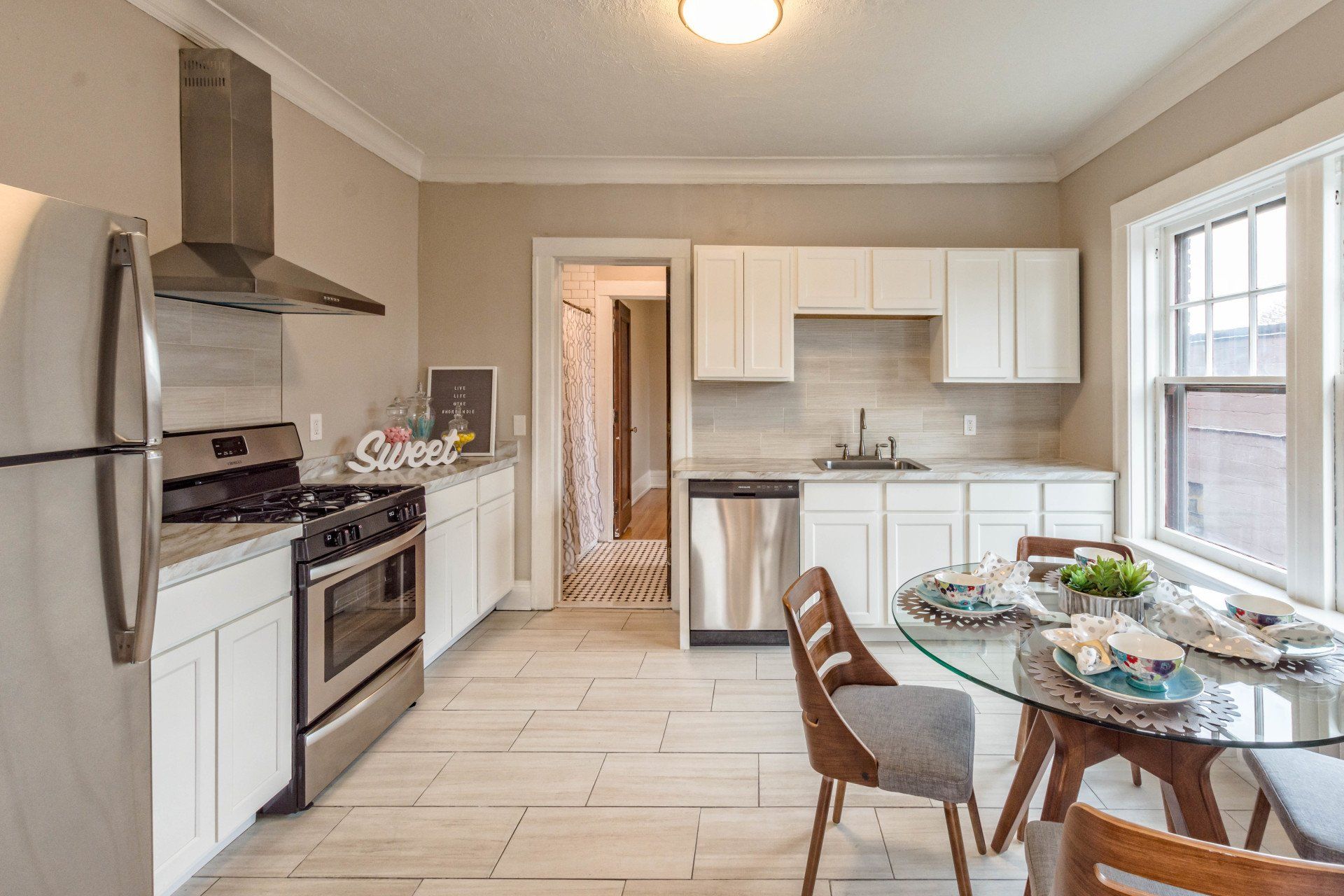 Renovated modern kitchen with stainless steel appliances and dishwasher
