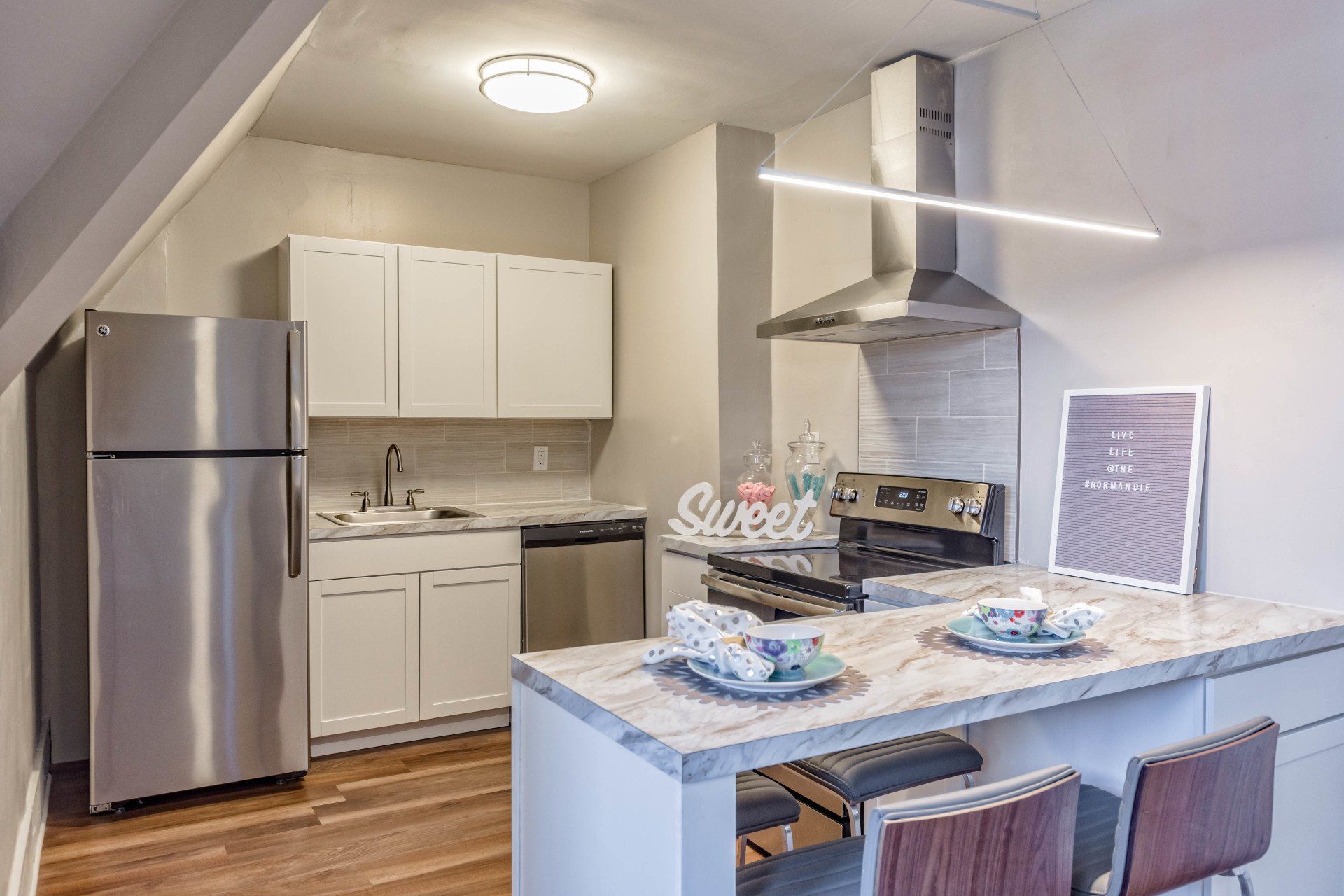 Renovated kitchen with stainless steel appliances and dishwasher