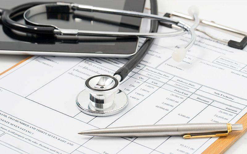 Medical Form And Stethoscope — Lafayette, LA — Acadiana Urgent Care Center