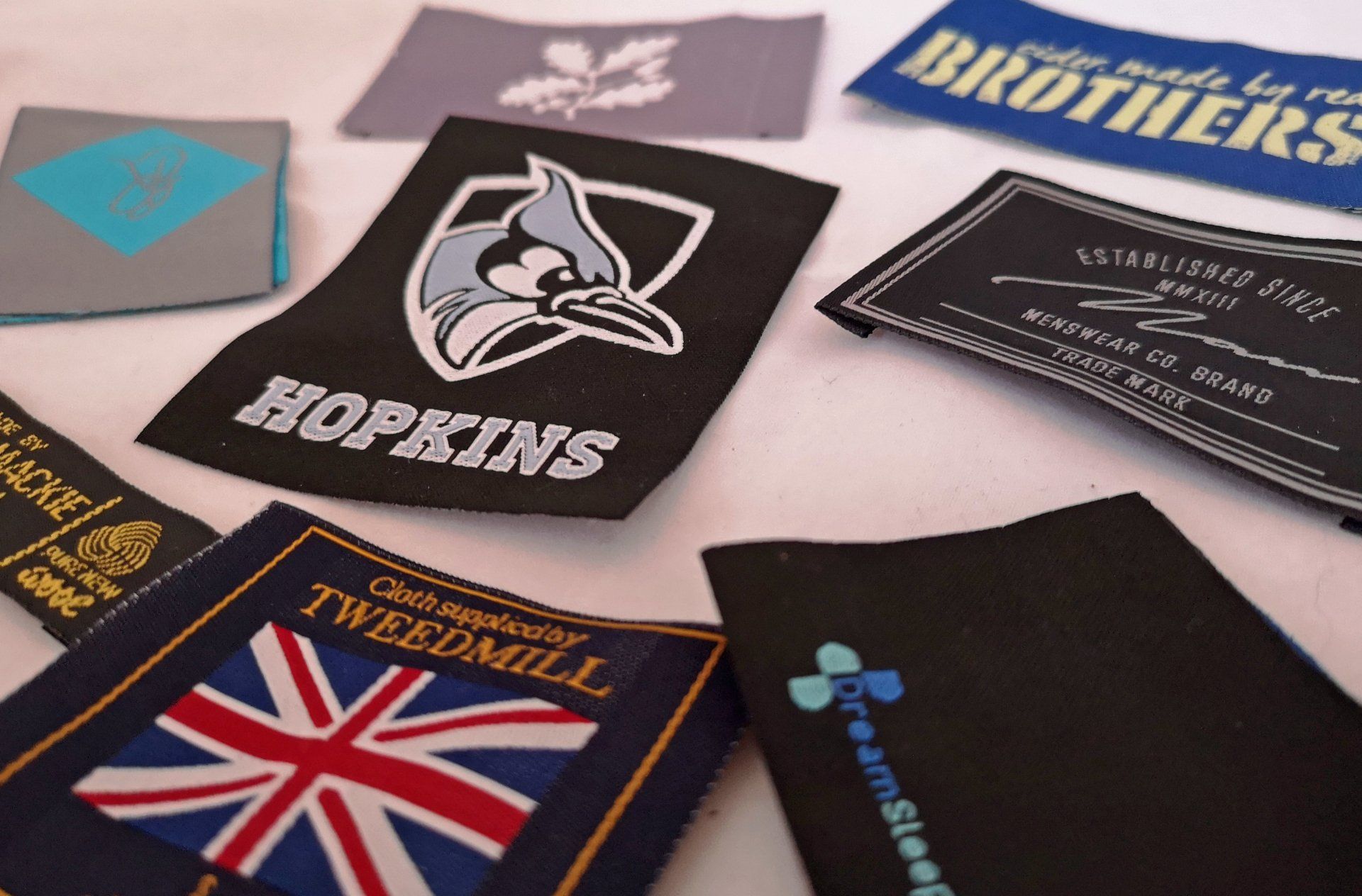Woven labels and badges