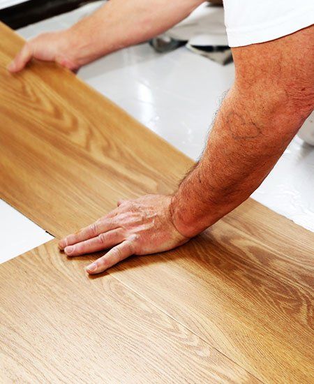 Hardwood Flooring — Man Installing Floor in Reno, NV Hardwood Flooring — Man Installing Floor in Reno, NV