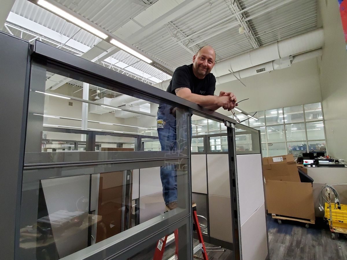 Man Leaning on Cubicle Divider — Anoka, MN — Dynamic Office Services