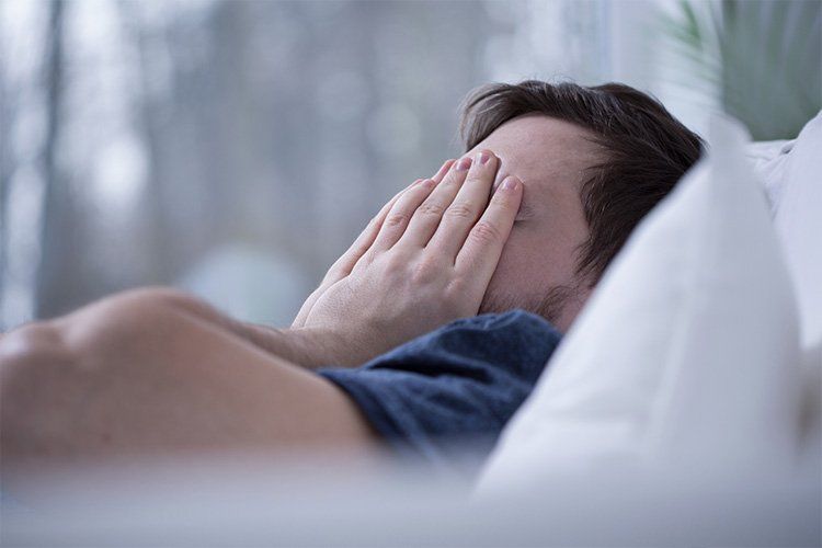man having trouble sleeping