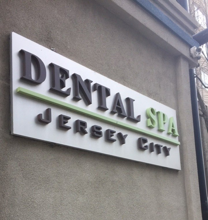A sign for the dental spa in jersey city