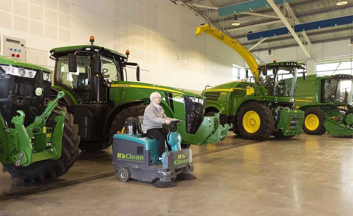 Cleaning event centre floor with ride on sweeper in Harrogate