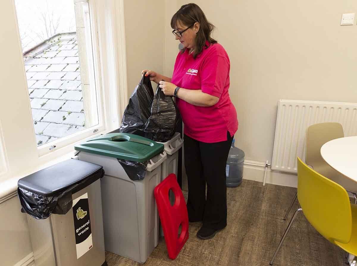 Emptying office kitchen recycling bins