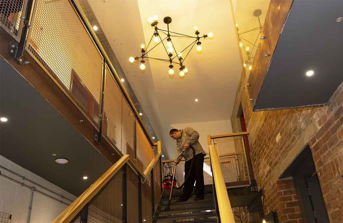 Vacuuming staircase in Harrogate offices