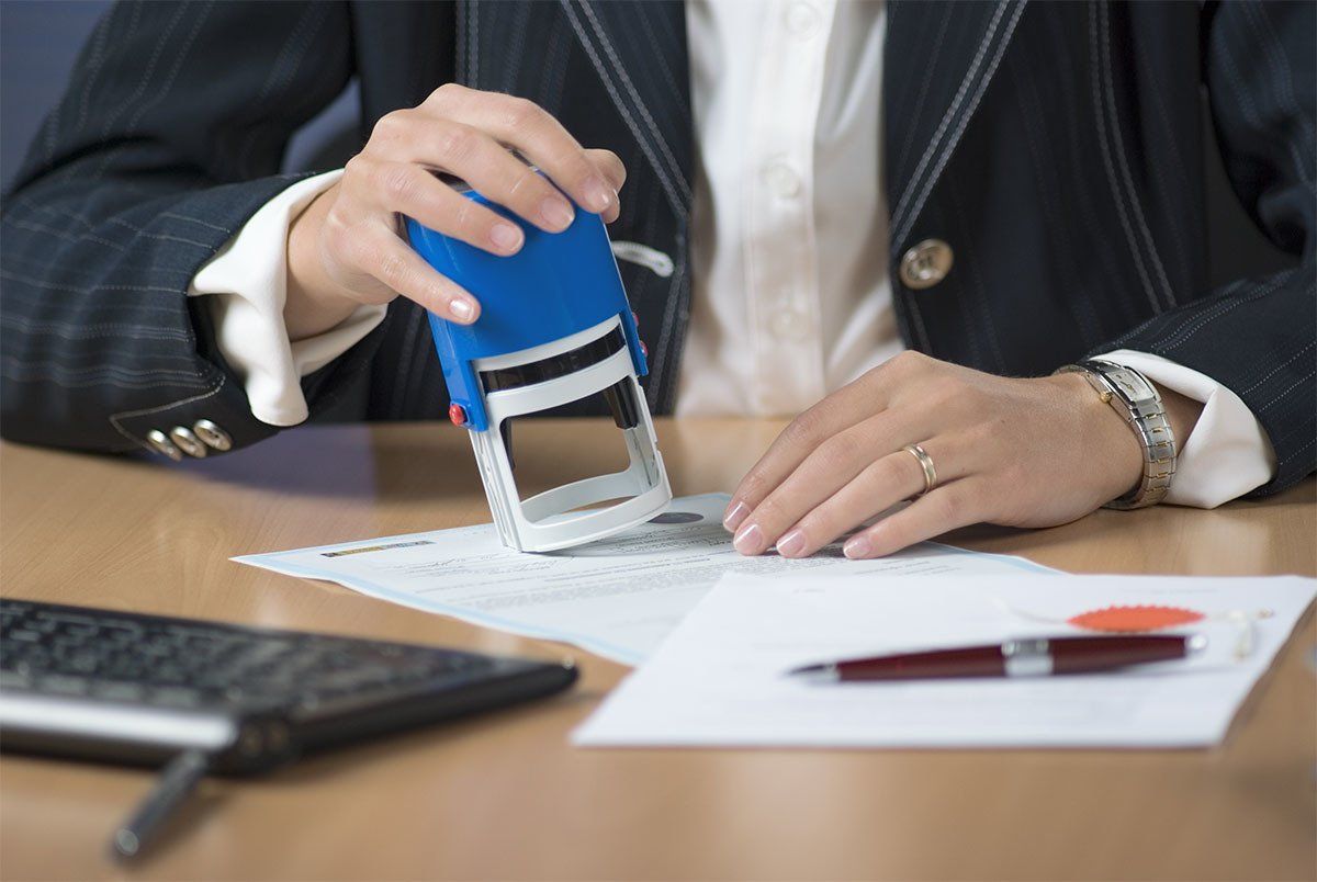 Woman stamping a document