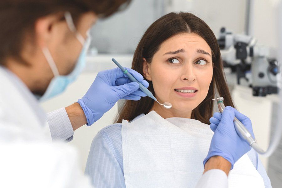 Woman Afraid of Dentist — Eastpointe, MI — Eastland & Professional Dental Center Woman Afraid of Dentist — Eastpointe, MI — Eastland & Professional Dental Center