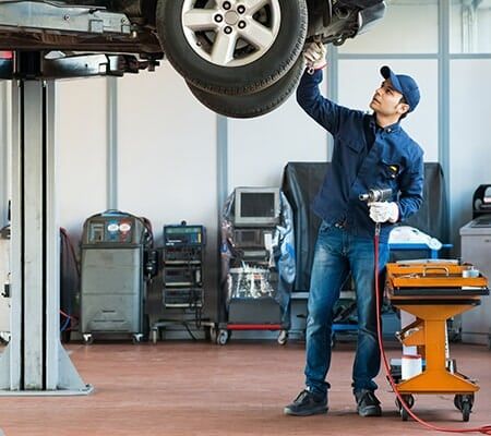 Mechanic Diagnosing Car — Auto Repair in Auburn, CA Mechanic Diagnosing Car — Auto Repair in Auburn, CA