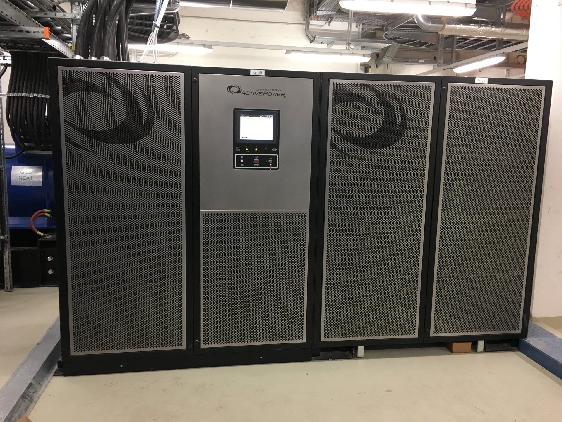 A large gray and black machine with a screen on it