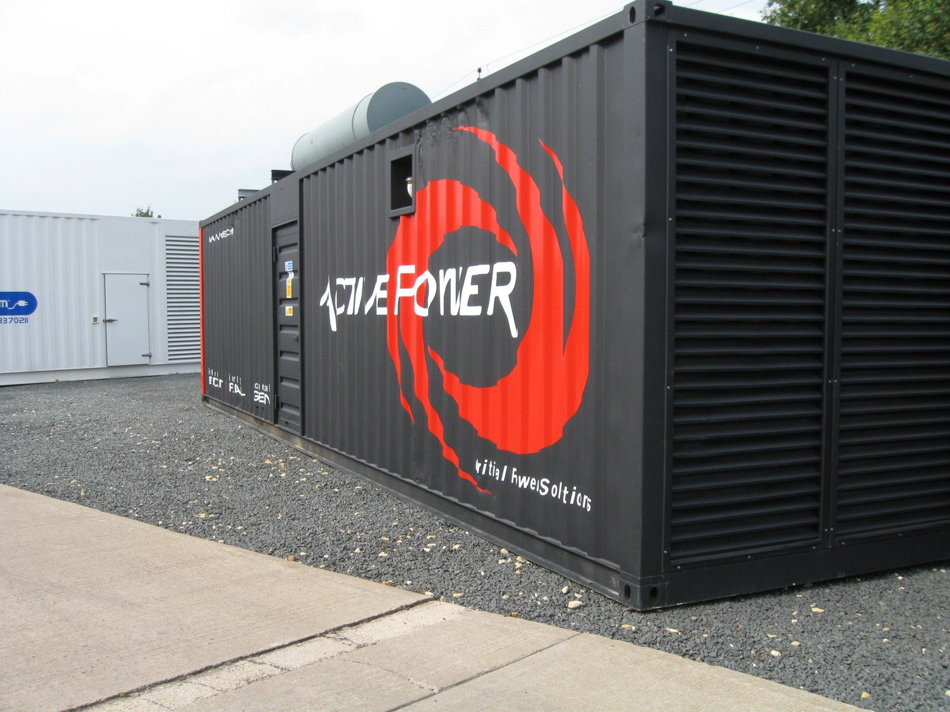 A black container with a red swirl and the word active power on it