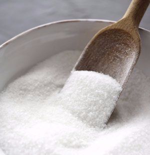 Bowl of salt with a wooden spoon used for enema therapy by Hertfordshire Colonics