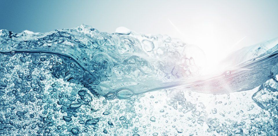 Blue water with a sunshine background