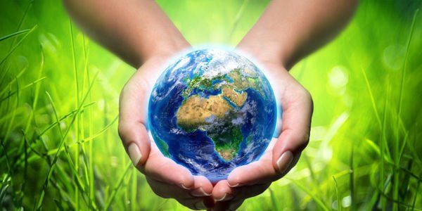 woman holding earth in her hands
