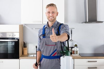 Pest Control Worker with Pesticide Container — Lake Mohegan, NY — CMA Pest Control Inc.