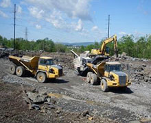 Truck Working At Industrial Site — Construction And Excavation Services in Harrisburg, PA Truck Working At Industrial Site — Construction And Excavation Services in Harrisburg, PA