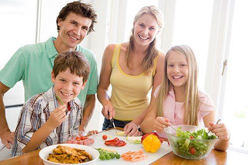 Family Preparing Meal - Exterminator in Ithaca, NY Family Preparing Meal - Exterminator in Ithaca, NY