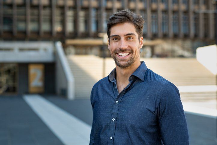 Portrait of casual smiling man in dress shirt