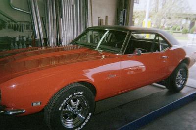 Customizable Muffler Services — Glossy Red Car Front in Bakersfield, CA