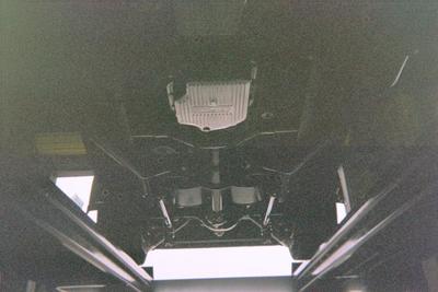 Customizable Service Muffler — Car Undercarriage Close Up in Bakersfield, CA